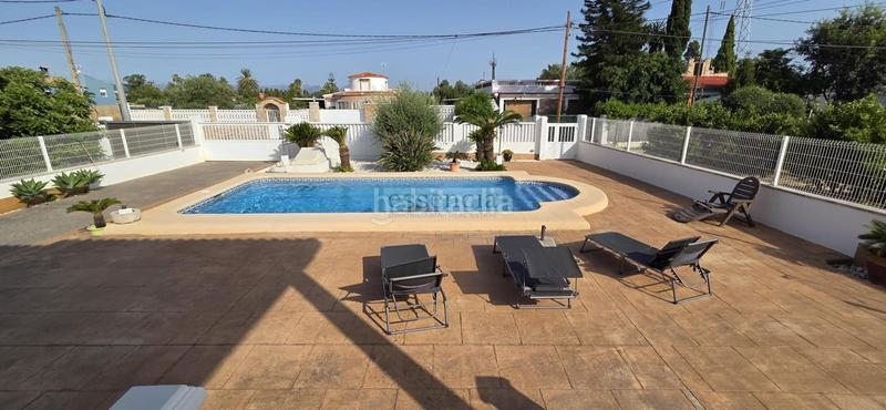 Foto 70db6bf4-a31e-4dca-8a0a-d46638294424. Chalet con riscaldamento parcheggio piscina in Oliva playa Oliva