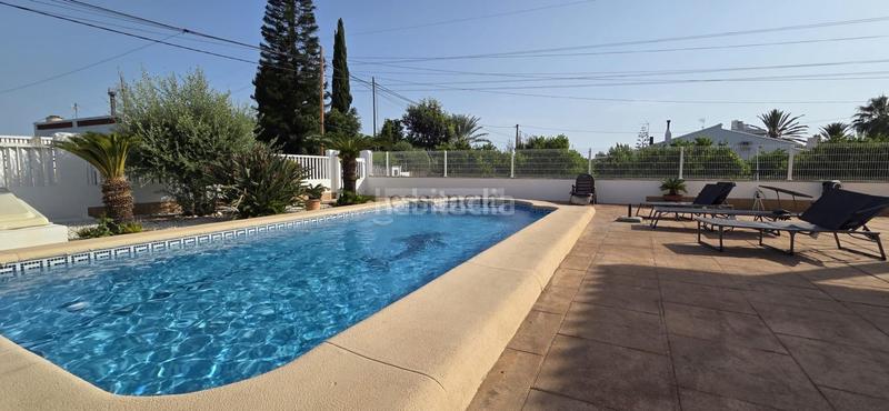 Foto e5855cba-5588-43e4-935e-3a4cb81fce64. Chalet con riscaldamento parcheggio piscina in Oliva playa Oliva