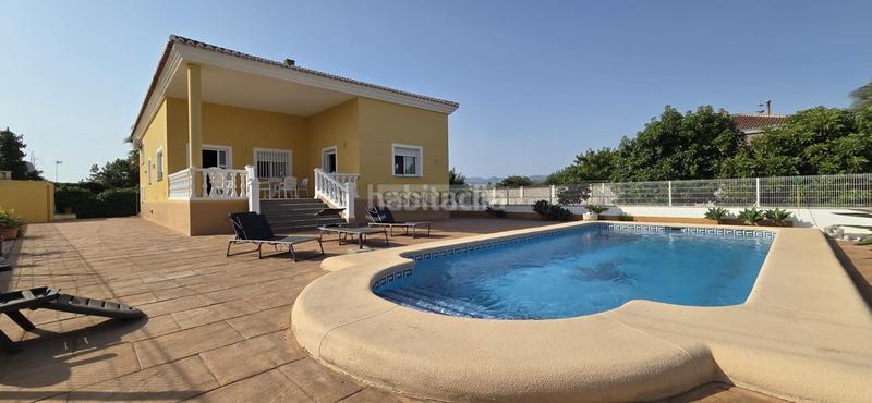 Foto e69b162c-f14e-43a3-9c25-f12c467df38f. Chalet con riscaldamento parcheggio piscina in Oliva playa Oliva