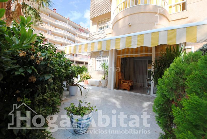 Foto 90d16928-8ec5-41a3-8f30-d201f472f338. Piso segunda línea de playa! exterior con piscina, garaje y terraza en Daimús