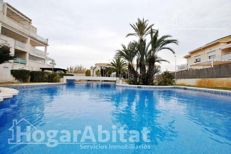 Foto e3e0f7b8-b98c-4609-9c31-cde4cbe8dcac. Piso acogedor y todo exterior en residencial con piscina y terraza cerca del mar en Oliva