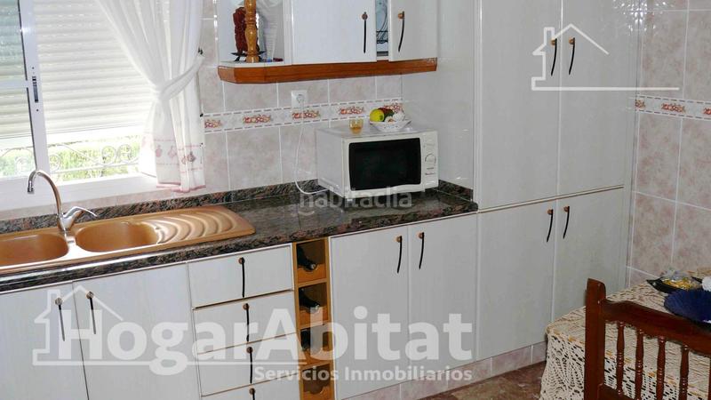 Foto ad3886ca-74fa-41ae-906c-286e2db76439. Chalet  con piscina, 3 terrazas y parking en Moncofa
