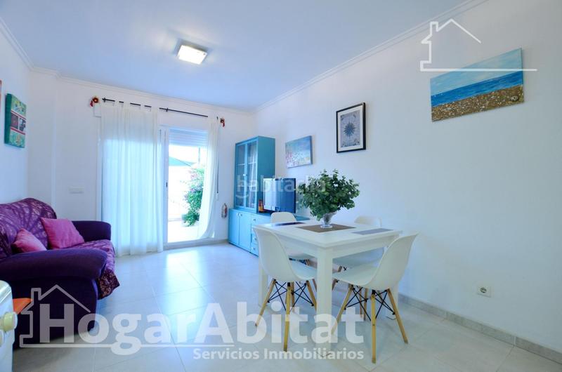 Foto e21e0fb7-1d71-45d9-80d9-13e3cb46ec34. Piso playa de daimuz! bajo esquinero y luminoso con parking y gran terraza en Daimús