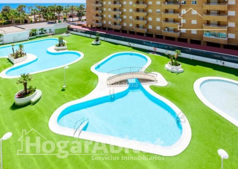 Foto eb8399c5-f76e-42d9-b3ea-fbcb73ce06ee. Piso vistas laterales al mar! seminuevo en residencial en 1 línea con piscina, terraza y garaje en Oropesa del Mar