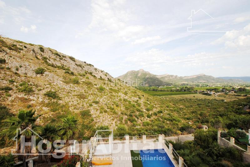 Foto 0bc6b509-ef6a-4576-a9df-e039ab5d737b. Chalet  con piscina, garaje, terraza y barbacoa en Gandia