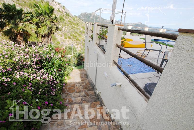 Foto 0d4f8c80-7bec-4e61-a937-d138efa98f82. Chalet  con piscina, garaje, terraza y barbacoa en Gandia