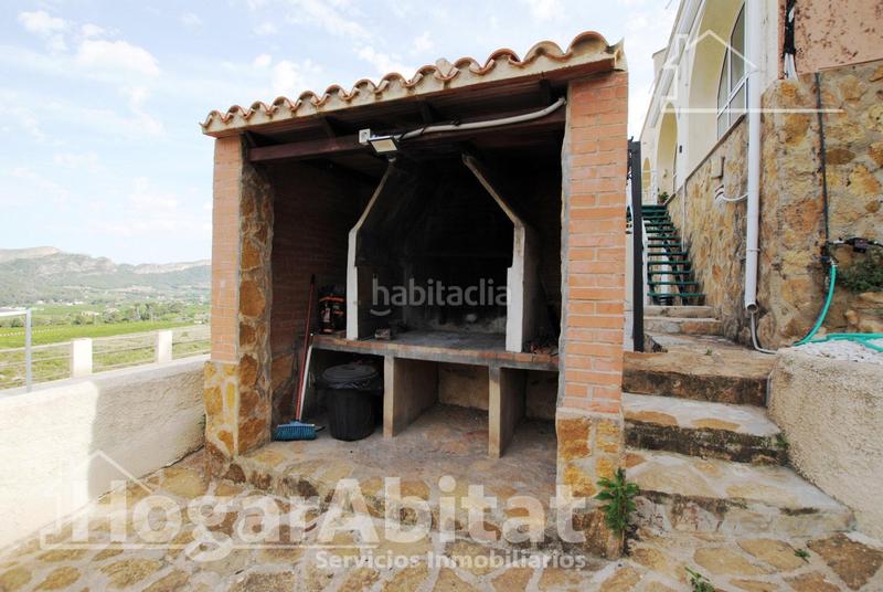 Foto db7b840d-69c6-454e-9e24-edba2874e139. Chalet  con piscina, garaje, terraza y barbacoa en Gandia