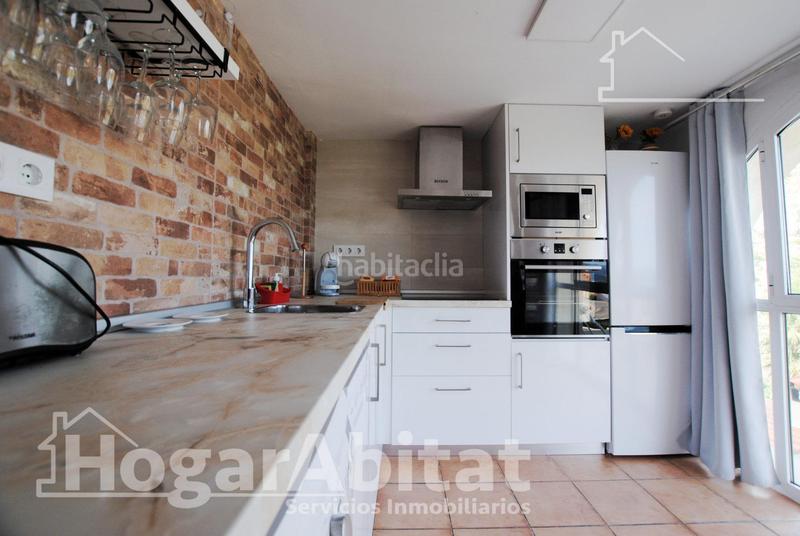 Foto dd84373b-5c79-44a5-b43f-8d41727b7555. Chalet  con piscina, garaje, terraza y barbacoa en Gandia