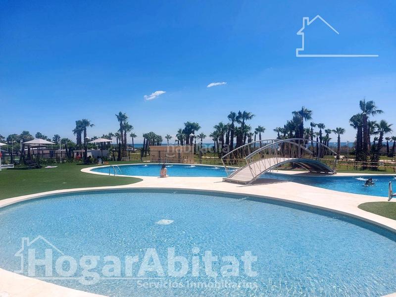 Foto 6fcbe188-107d-402d-8dd7-03dd1d8e2c1e. Piso totalmente nuevo! exterior en residencial con piscina y terraza junto a la playa en Cabanes