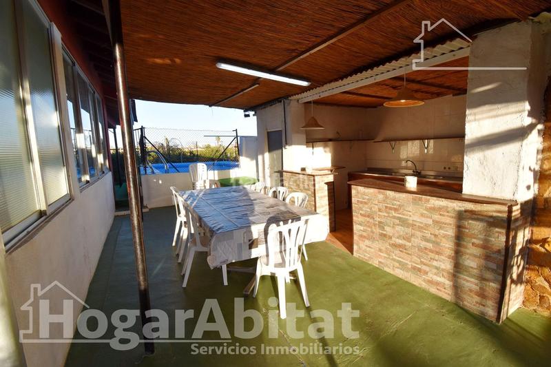 Foto 212a81eb-1d33-4056-9fb3-7aa0facf7562. Chalet  con gran terreno, piscina, barbacoa y garaje en Gandia