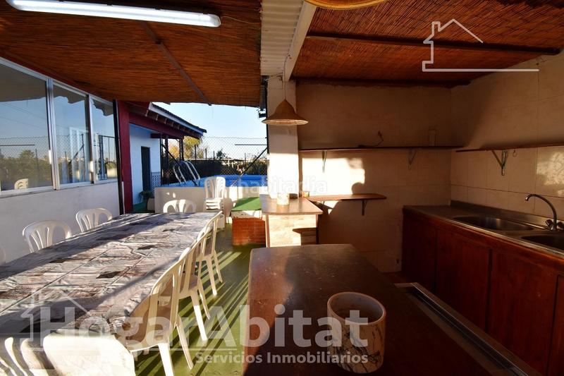 Foto 513e95a1-8c55-415c-90ee-4e1cbd5559f8. Chalet  con gran terreno, piscina, barbacoa y garaje en Gandia
