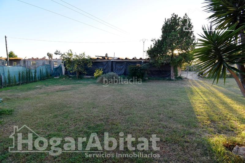 Foto a08694a6-3954-416e-a845-397801e9c70c. Chalet  con gran terreno, piscina, barbacoa y garaje en Gandia