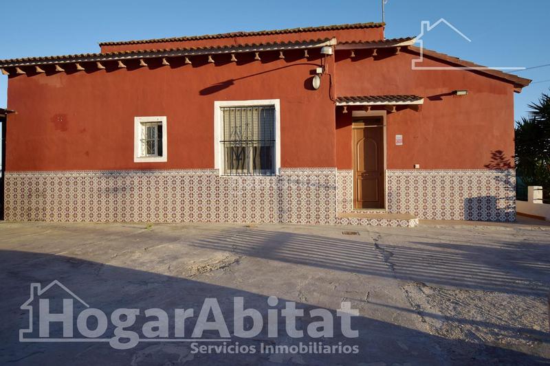 Foto ee3028d6-249f-49a0-ba91-4cdfb7334bbf. Chalet  con gran terreno, piscina, barbacoa y garaje en Gandia