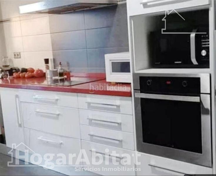Foto 89d0b4e4-80ae-43d7-b8f7-99462366b981. Casa adossada amb calefacció aparcament a Polinyà de Xúquer