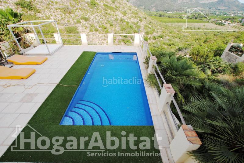 Foto 62628afb-5db0-4344-81de-e08dcf0f6267. Chalet  con piscina, garaje, terraza y barbacoa en Gandia