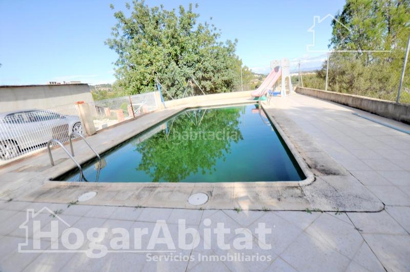 Foto b13d9ca0-edea-4412-83d1-dec7112ff540. Chalet con parcheggio piscina in Godelleta