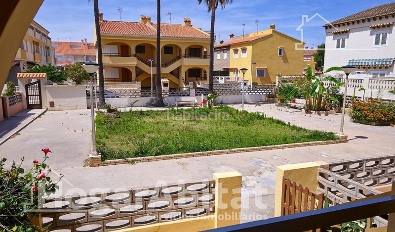 Foto 5cc9e824-8eac-4c1e-b3a5-04c8d6dd9b21. Casa adossada amb aparcament piscina a Mareny de Barraquetes Sueca