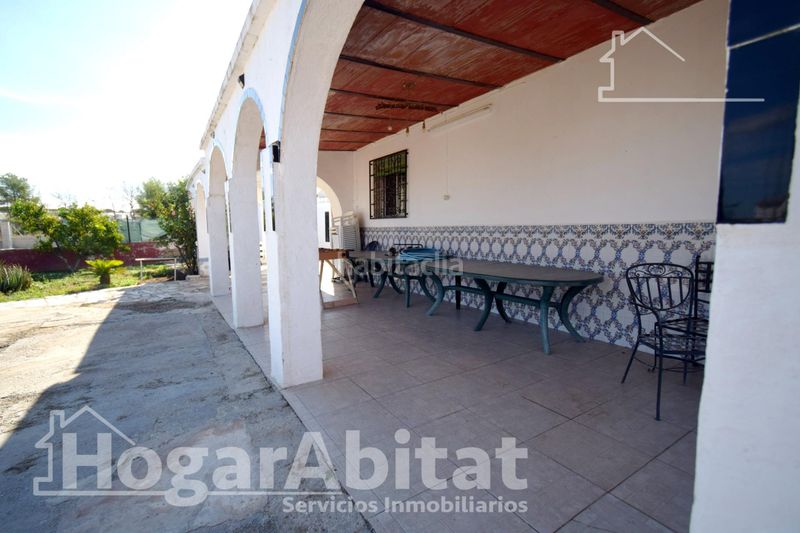 Foto a3741c10-774c-492c-8853-43cacb6b0d8d. Chalet  rústico con piscina, garaje y terraza en Vilamarxant