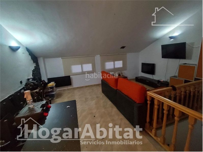 Foto a150ccd4-e2b2-4e0e-9ce3-a3d4d87ab53b. Casa adossada amb aparcament piscina a Vilamarxant