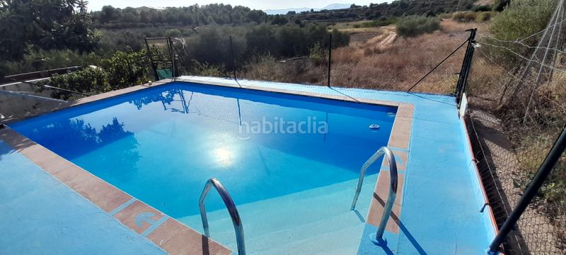 Foto 3a9773ba-e542-46b5-bb03-2a2e97270494. Casa chalet con piscina, placas solares y gran parcela en entorno natural. solana en Cheste