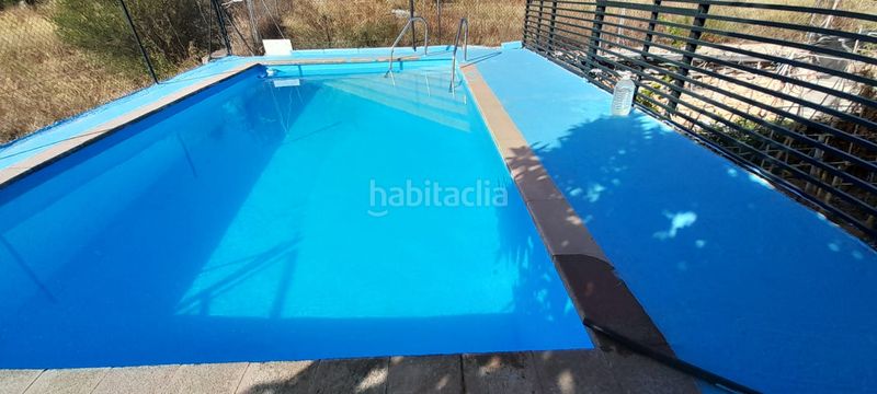 Foto 50249482-1536-4cfe-8cf3-4a00cb3231ea. Casa chalet con piscina, placas solares y gran parcela en entorno natural. solana en Cheste