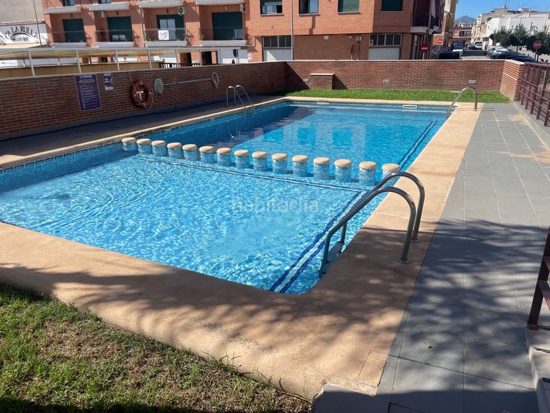 Foto cb1ac091-8b3e-46c9-89af-badcbb1e5ff8. Casa adossada amb aparcament piscina a Bellreguard