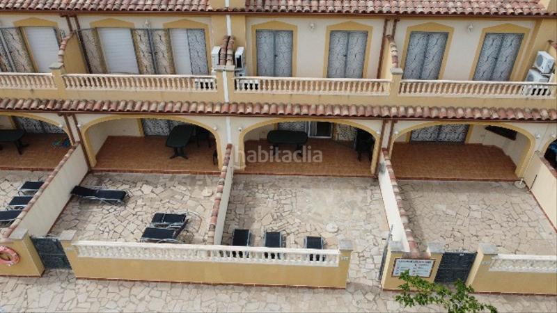 Foto ed8f3722-c3f4-45ff-af4f-8e8f2922cb19. Casa adosada precioso adosado en el centro de miami playa!! en Miami Platja