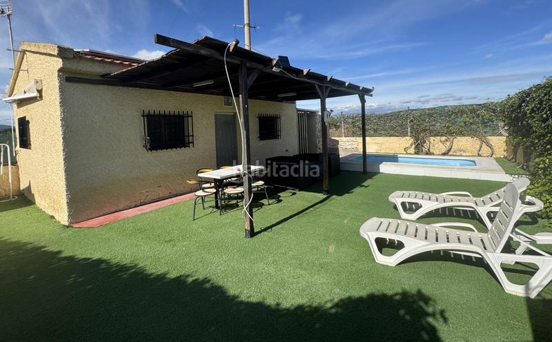 Foto 1f60fc3c-98cb-4a12-a869-713b00049e57. Xalet amb aparcament piscina a Vilamarxant