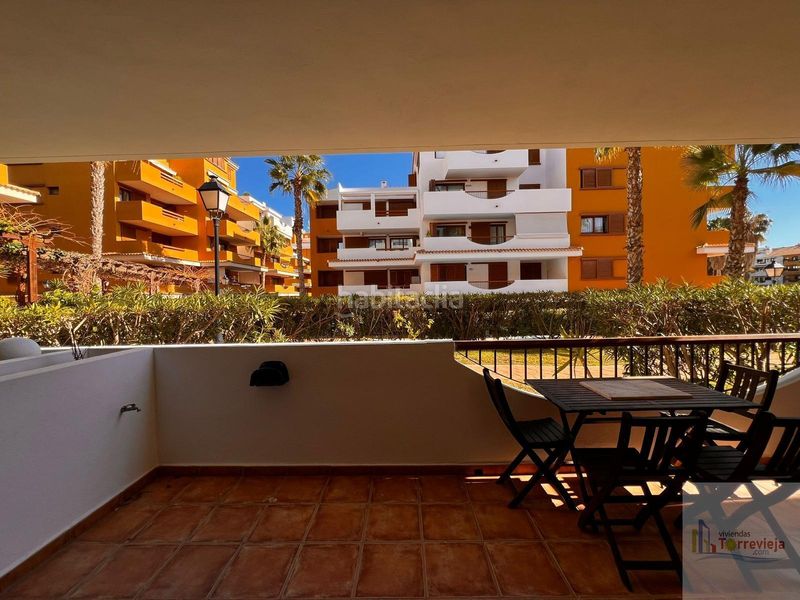 Foto 0245652d-fa45-4b4e-96a6-6b50e4cdde82. Apartament amb calefacció aparcament piscina a Punta Prima Torrevieja