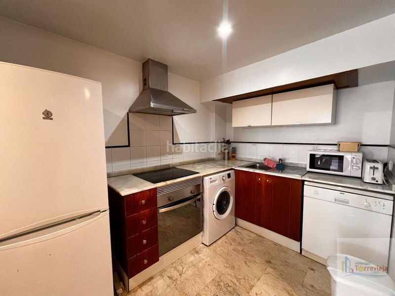 Foto 2a9f31f9-7eee-4a21-a9de-993b480213ee. Apartament amb calefacció aparcament piscina a Punta Prima Torrevieja