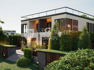 Casa a Fenals. Moderna y amplia casa adosada de obra nueva con jardín y piscina