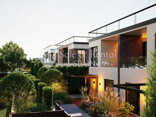 Casa a Fenals. Moderna y amplia casa adosada de obra nueva con jardín y piscina