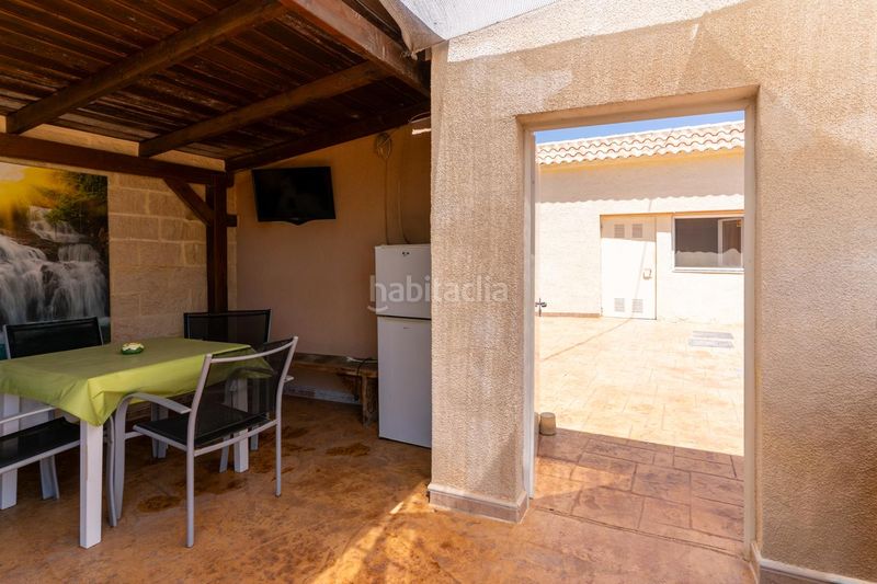 Foto 7cda9728-8a94-43c4-ac98-201b25525c2f. Casa amb aparcament piscina a La Marina Elche / Elx