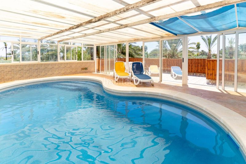 Foto eee11b63-7a0a-40a3-8c9f-5ab764d2cb5d. Casa amb aparcament piscina a La Marina Elche / Elx