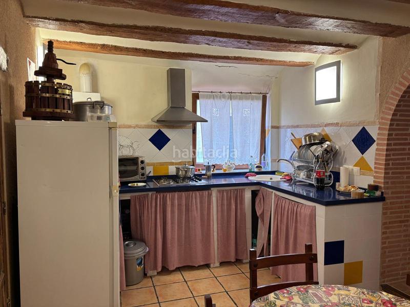 Foto bda3771b-8c1b-47a3-aa2e-174f0d59ae08. Casa aparellada amb calefacció a Benilloba