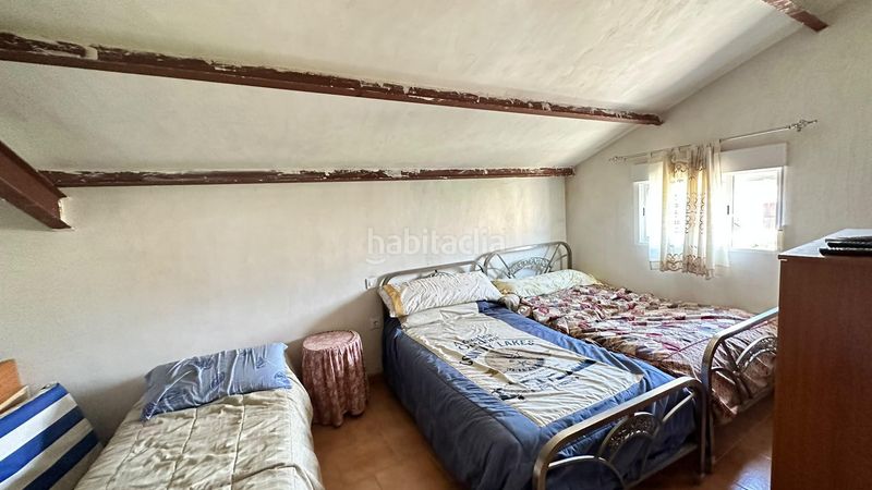Foto f80a7d8f-6ea3-4c11-9bfa-8520feaeb62f. Chalet fachada de cemento con revestimiento de piedra en Pinarnegrillo
