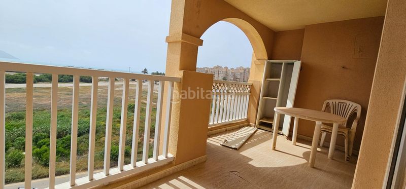 Foto 175b976f-bfac-42e2-a17b-a1dfd3a289a7. Apartamento  en urbanización privada con pistas deportivas, piscina y preciosos jardines en Manga del Mar Menor (La)