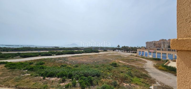 Foto 3c531d9b-0164-419c-89cc-d150e91db37e. Apartamento  en urbanización privada con pistas deportivas, piscina y preciosos jardines en Manga del Mar Menor (La)