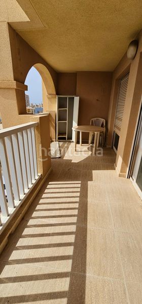 Foto c5f3bec0-3a9c-4d58-9561-61c032e9c0ee. Apartamento  en urbanización privada con pistas deportivas, piscina y preciosos jardines en Manga del Mar Menor (La)