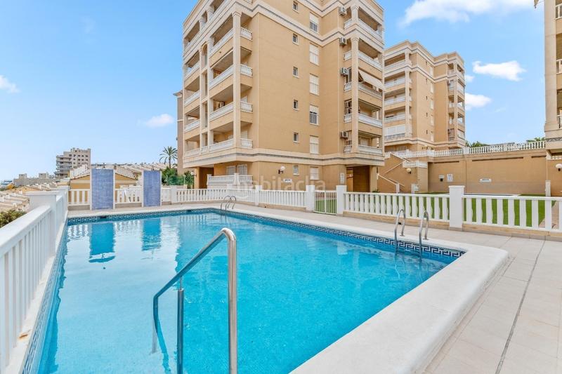 Foto 134af8f3-19d3-4018-94db-0dbfe3fb1849. Apartamento  bajo esquina de 2 dorm en urb con piscina y terraza y entrada independiente de la escalera común en Elche / Elx