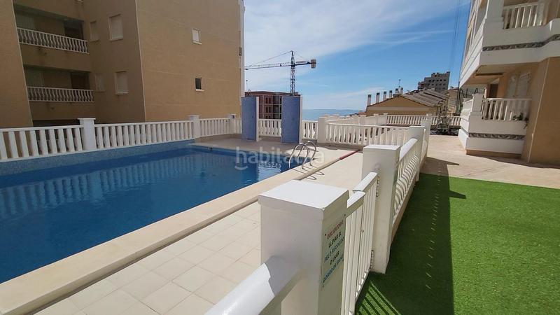 Foto 6625de12-ffb2-4eb1-8a74-917a9bbf817f. Apartamento  bajo esquina de 2 dorm en urb con piscina y terraza y entrada independiente de la escalera común en Elche / Elx
