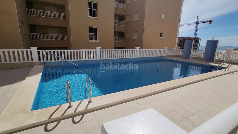 Foto 7b17dfb3-d535-4519-bad8-9d21c9d089d2. Apartamento  bajo esquina de 2 dorm en urb con piscina y terraza y entrada independiente de la escalera común en Elche / Elx