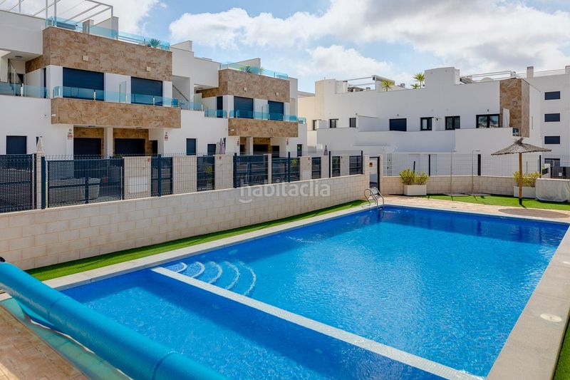 Foto 30d01cd6-a6ec-46a2-bc97-16eb0ad2645c. Reihenhaus mit parking pool in Villamartín-Las Filipinas Orihuela