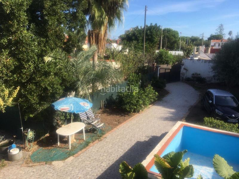 Foto 08e4bc5b-2d94-43b8-8819-be9cddefd82a. Chalet con parcheggio piscina in Playa Burriana