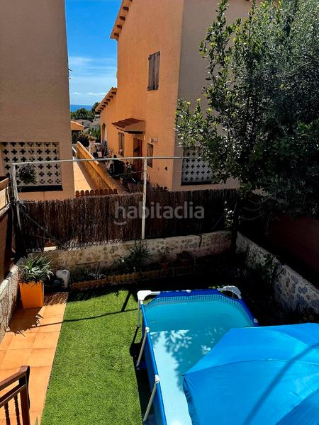 Foto ad6a5bbb-637e-4fd0-b312-39346070dcbb. Casa adossada amb calefacció a Els Masos - Els Garrofers Coma-ruga