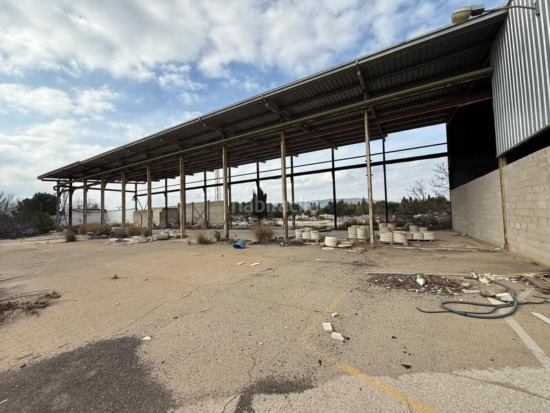 Foto dc2296bb-dae5-4ec9-8e90-ad4d28ccc914. Terreno residencial suelo rústico con dos naves y una vivienda en Canals