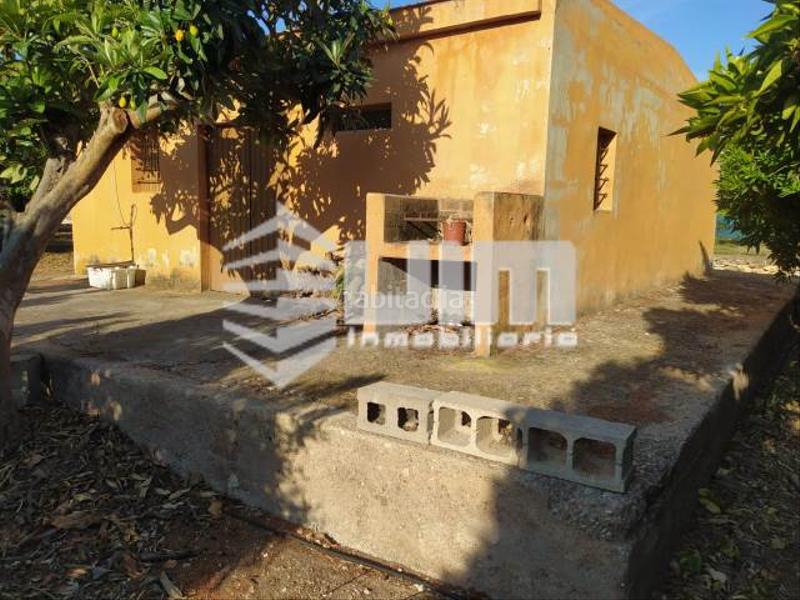Foto 2de64f8b-0b8b-4849-af25-fec3a110f22e. Masía ref 28207terreno con casa diafano en venta o, de 70 m, piscina, jardín, de 15400 m, zona monte, casa de aperos de 70m2 en Sagunt